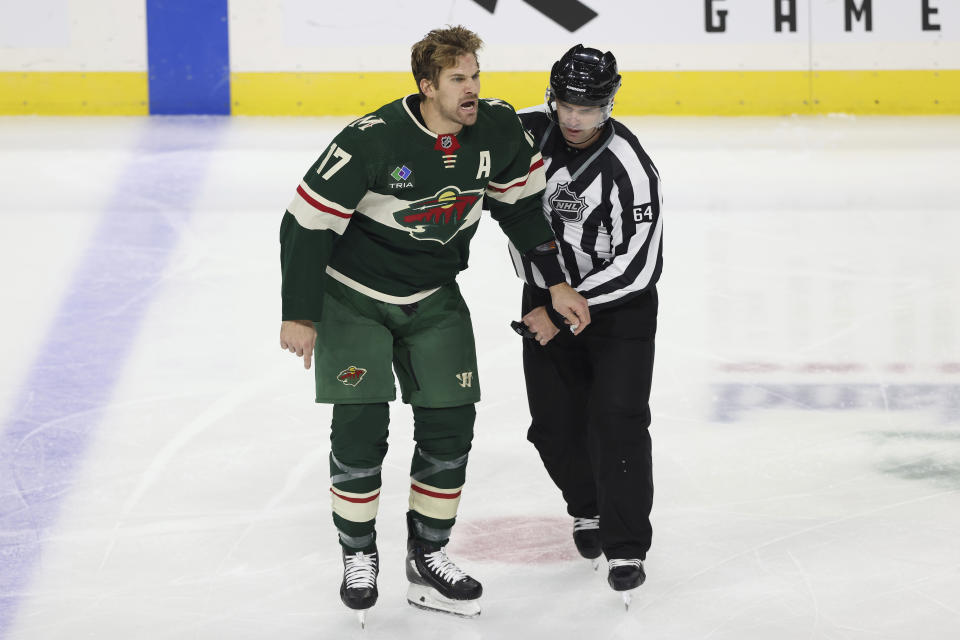 CORRECTS TO PENALIZED NOT EJECTED - Minnesota Wild left wing Marcus Foligno (17) reacts after being penalized for misconduct in the second period of an NHL hockey game against the Arizona Coyotes, Sunday, Nov. 27, 2022, in St. Paul, Minn. (AP Photo/Stacy Bengs)