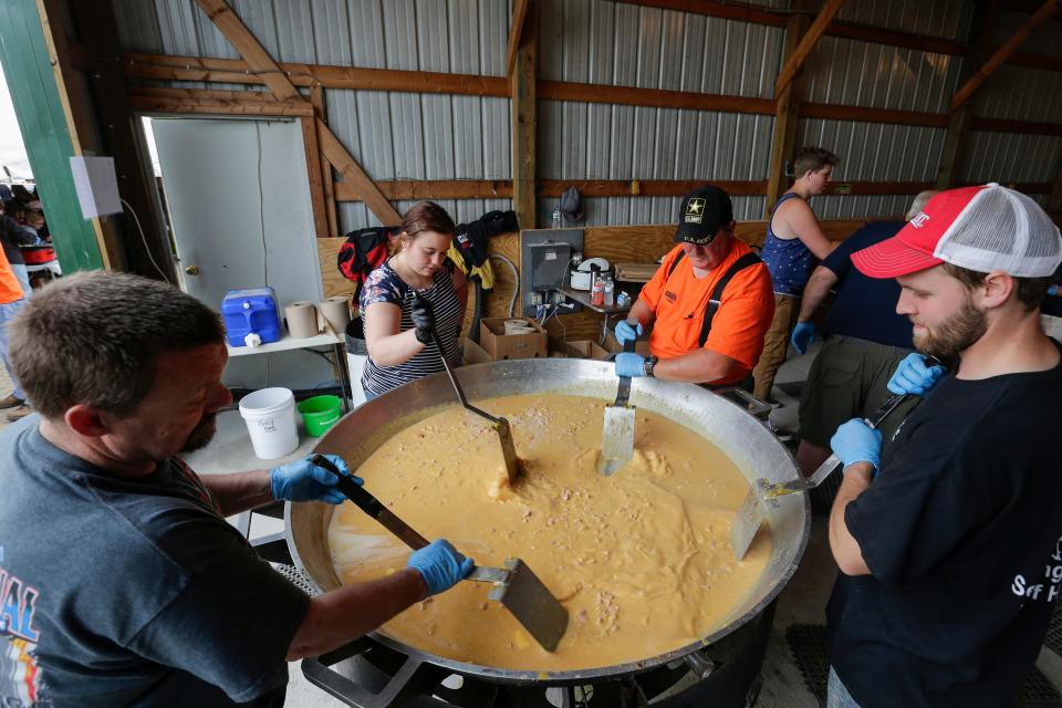 Volunteers make scrambled eggs during the Manitowoc County Breakfast on the Farm at Haelfrisch Dairy Farms Sunday, June 9, 2019, in Brillion, Wis. Joshua Clark/USA TODAY NETWORK-Wisconsin