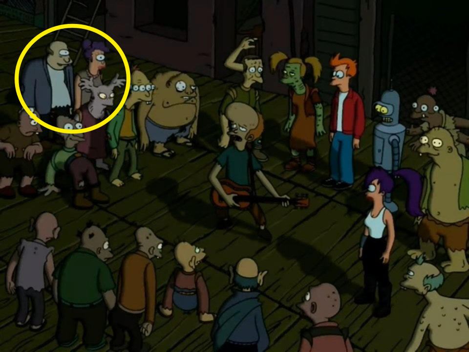 Fry, Leela, and Bender standing with a crowd of sewer mutants around a mutant guitarist in "Futurama"