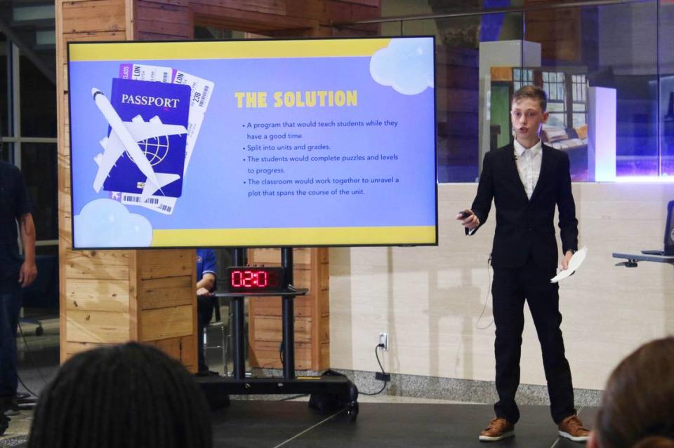 Miles Muehlbach, a seventh-grader at Indian Hills, presents his idea for a game that he thinks will help kids with math lessons. He won one of three main awards to fund it at The Next Great Idea Pitch Competition Saturday.