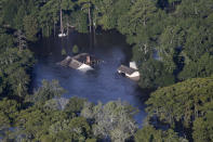 <p>The roofs of homes are seen protruding from floodwaters in the aftermath of Tropical Storm Harvey in Orange, Texas, Thursday, Aug. 31, 2017. (Photo: Gerald Herbert/AP) </p>