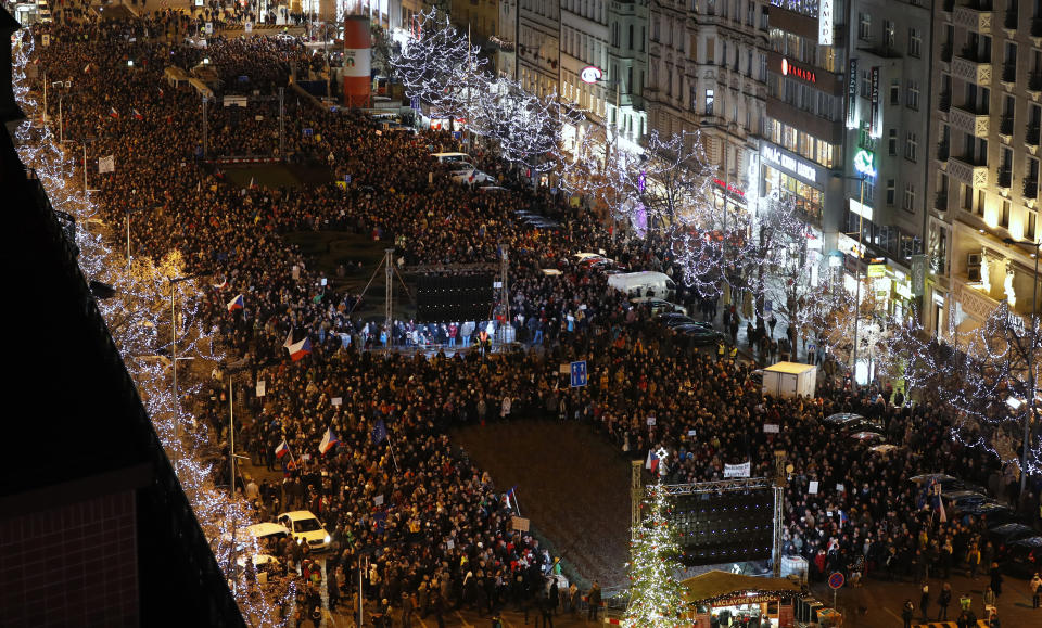 Several thousands demonstrators gather to demand the resignation of Czech Republic's Prime Minister Andrej Babis, at the Wenceslas square in Prague, Czech Republic, Tuesday, Dec. 10, 2019. Babis faces legations that he has misused EU subsidies for a farm he transferred to his family members, though he denies wrongdoing. (AP Photo/Petr David Josek)