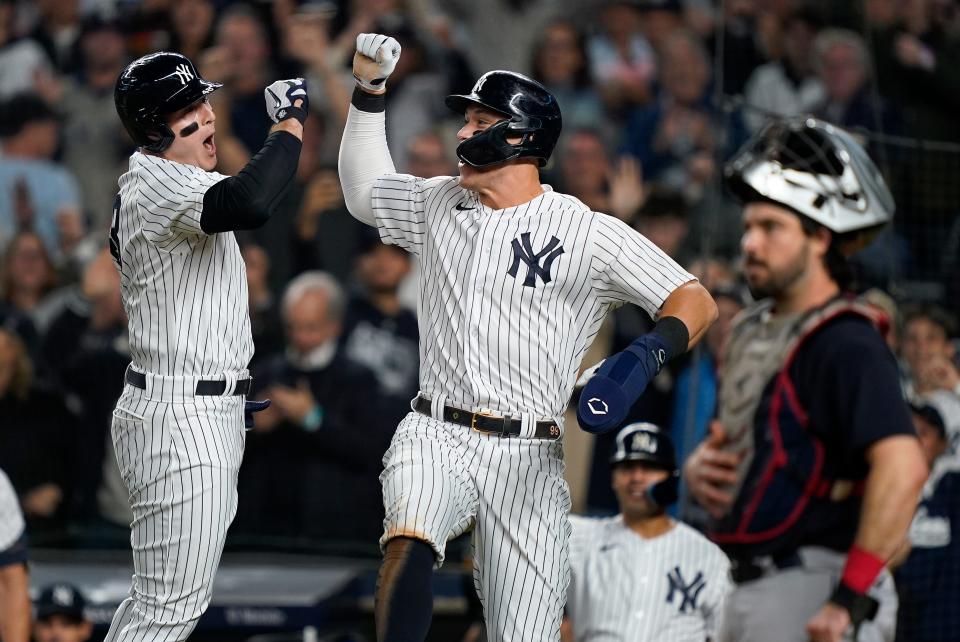 New York Yankees Anthony Rizzo, left, celebrates with Aaron Judge after hitting a two-run home run against the Cleveland Guardians during the sixth inning of Game 1 of an American League Division baseball series, Tuesday, Oct. 11, 2022, in New York. (AP Photo/John Minchillo)