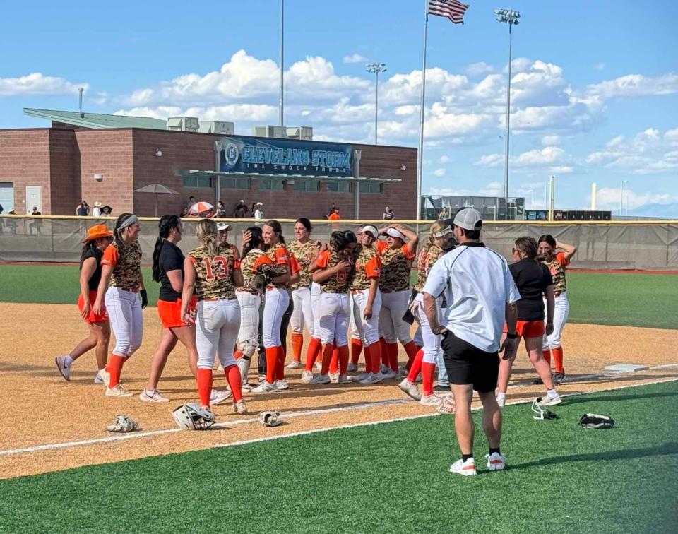 The Artesia High School softball team celebrates a victory over the Silver High Fighting Colts in the 4A state playoffs consolation bracket.
