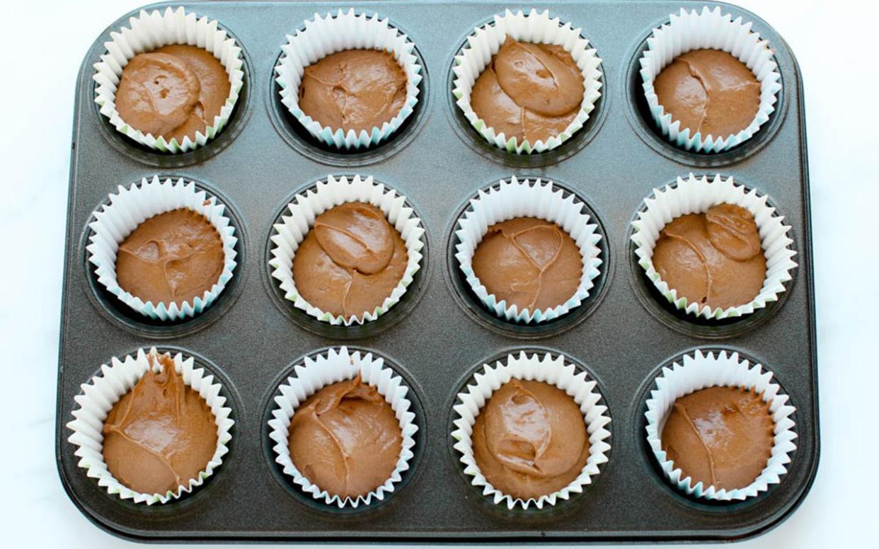Cupcake batter in muffin tins