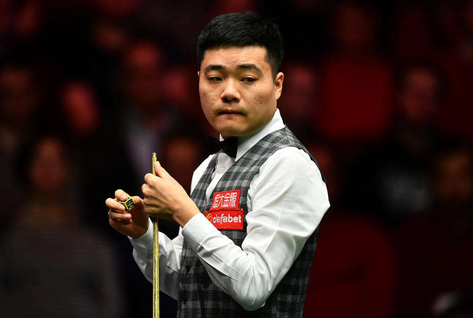 Ding Junhui of China looks on during his first round match against Kyren Wilson of England at the Dafabet Masters in London on Jan. 15, 2017.