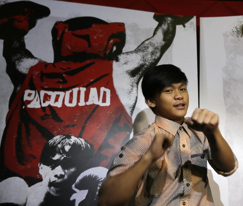 In this Tuesday, April 14, 2015 photo, Filipino actor Buboy Villar, who plays the role of the young Manny Pacquiao, poses before the premiere showing of &quot;Kid Kulafu&quot;, a film about Filipino boxing champion Manny Pacquiao, at cinemas at Rockwell Shopping complex at the financial district of Makati city, east of Manila, Philippines. As a dirt-poor rookie boxer in the southern Philippines, Manny Pacquiao started his phenomenal rise to global fame not as the Pacman, as he is sometimes called, but as “Kid Kulafu.” The film opened Wednesday in more than 70 theaters across the Philippines, ahead of Pacquiao&#39;s May 2 megafight with Floyd Mayweather and will be shown in some U.S. and Canadian theaters beginning April 24.(AP Photo/Bullit Marquez)