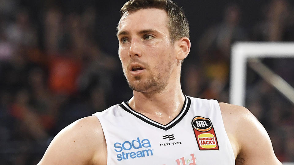 Mitch McCarron and Melbourne United teammate Jo Lual-Acui have tested positive for the coronavirus, prompting the NBL to shut down approved training for them and the South-East Melbourne Phoenix. (Photo by Ian Hitchcock/Getty Images)