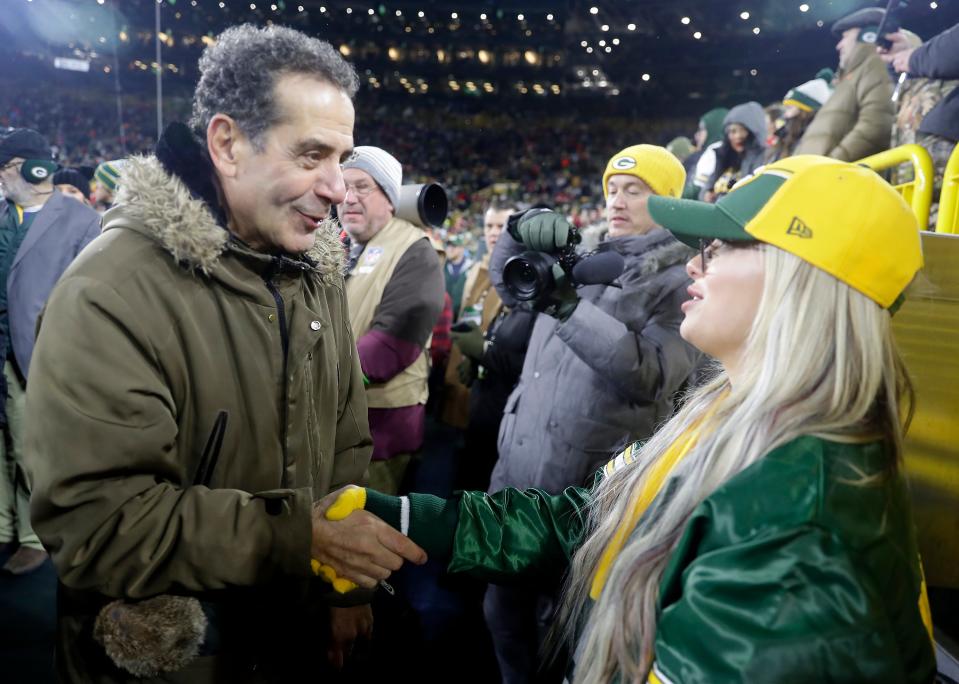 Actor Tony Shalhoub talks with WWE superstar Liv Morgan before the Green Bay Packers' game Sunday night against the Kansas City Chiefs at Lambeau Field.