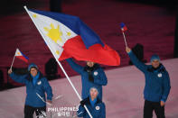 <p>Philippines’ flagbearer Asa Miller leads the delegation parade during the opening ceremony of the Pyeongchang 2018 Winter Olympic Games at the Pyeongchang Stadium on February 9, 2018. (Photo by ROBERTO SCHMIDT/AFP/Getty Images) </p>