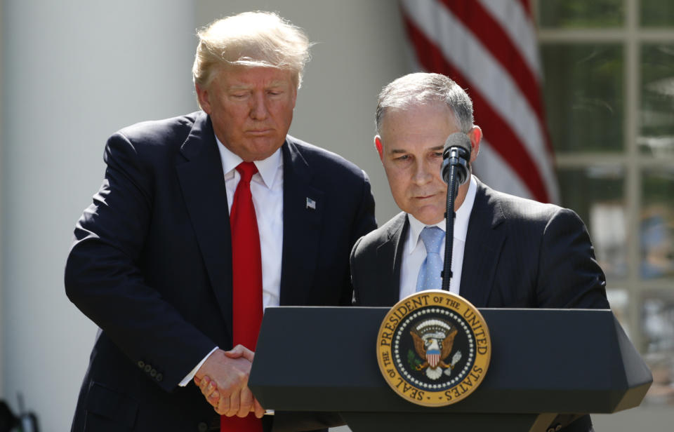 President Donald Trump invites Pruitt to the podium after announcing his decision&nbsp;to withdraw&nbsp;the United States from the Paris climate agreement on June 1, 2017. (Photo: Kevin Lamarque / Reuters)