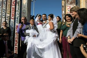 Brian Houston and Evelia Reyes with their families.