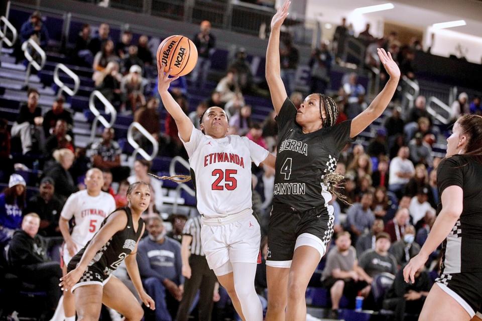 Eitwanda's Aliyahna Morris make a layup over Sierra Canyon's Mackenly Randolph.