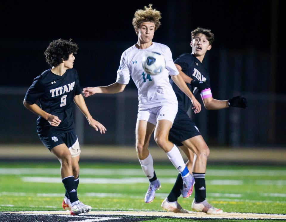 Gulf Coast's Caleb Peterson (14) attempts to stop the ball during the boys high school soccer game between Golden Gate and Gulf Coast on Tuesday, Jan. 18, 2022 at Golden Gate High School in Naples, Fla. 