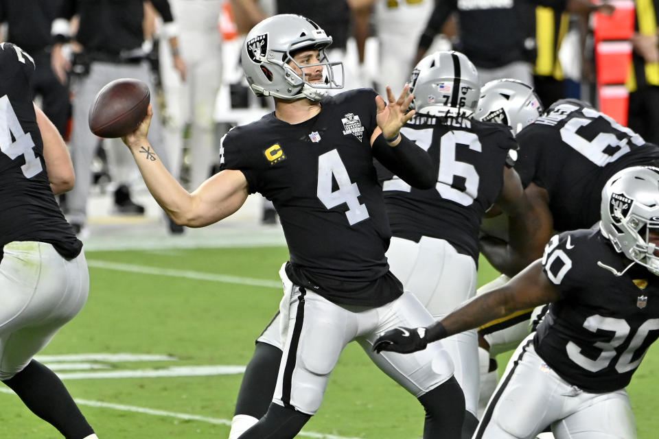 Las Vegas Raiders quarterback Derek Carr (4) throws against the New Orleans Saints during the second half of an NFL football game, Monday, Sept. 21, 2020, in Las Vegas. (AP Photo/David Becker)