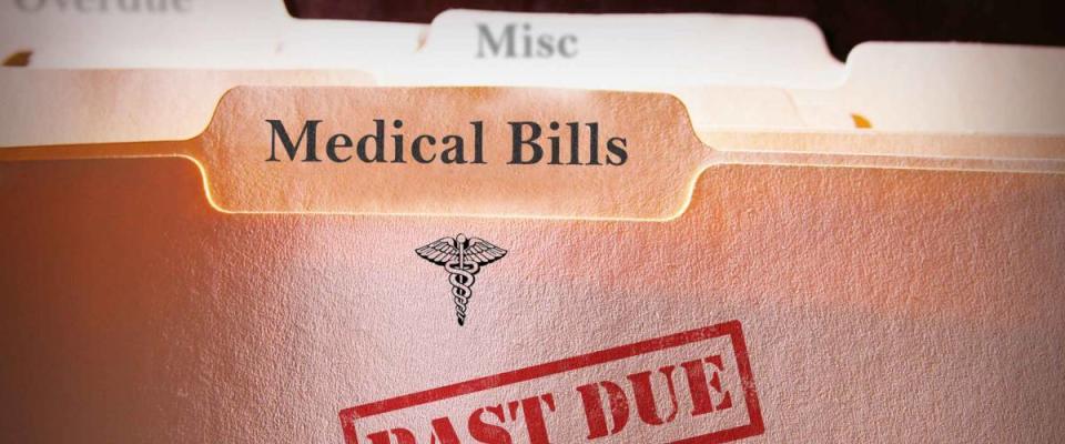 File folders with Past Due Medical Bills text