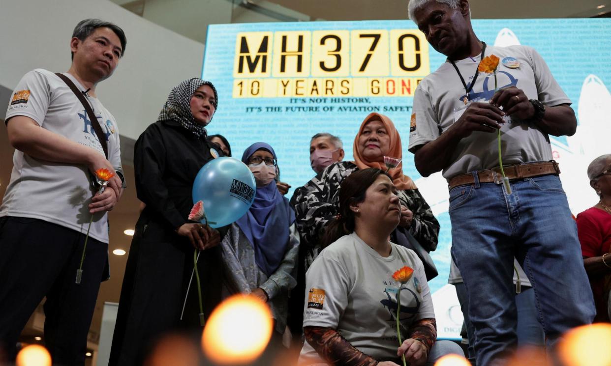 <span>Families of those onboard the missing MH370 flight take part in the annual remembrance event in Subang Jaya, Malaysia, on Sunday.</span><span>Photograph: Hasnoor Hussain/Reuters</span>