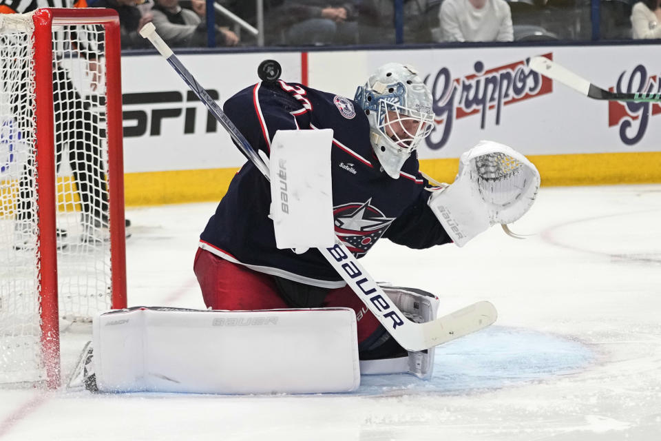 Columbus Blue Jackets goaltender Spencer Martin (30) blocks a shot in the third period of an NHL hockey game against the Dallas Stars, Thursday, Nov. 9, 2023, in Columbus, Ohio. (AP Photo/Sue Ogrocki)