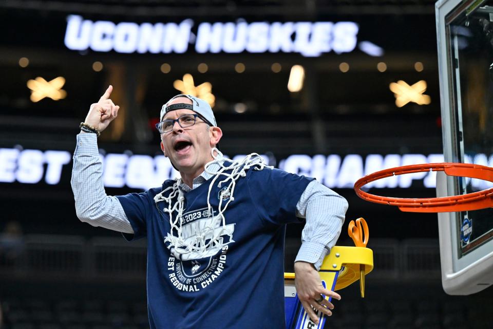 UConn head coach Dan Hurley celebrates after cutting down the netting from the 82-54 win against Gonzaga of an Elite 8 college basketball game in the West Region final of the NCAA Tournament, Saturday, March 25, 2023, in Las Vegas. (AP Photo/David Becker)