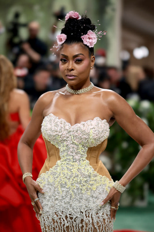<p>Photo by Dimitrios Kambouris/Getty Images for The Met Museum/Vogue</p><p>The <em>Color Purple </em>actress added florals to her updo for a romantic, whimsical look. </p>