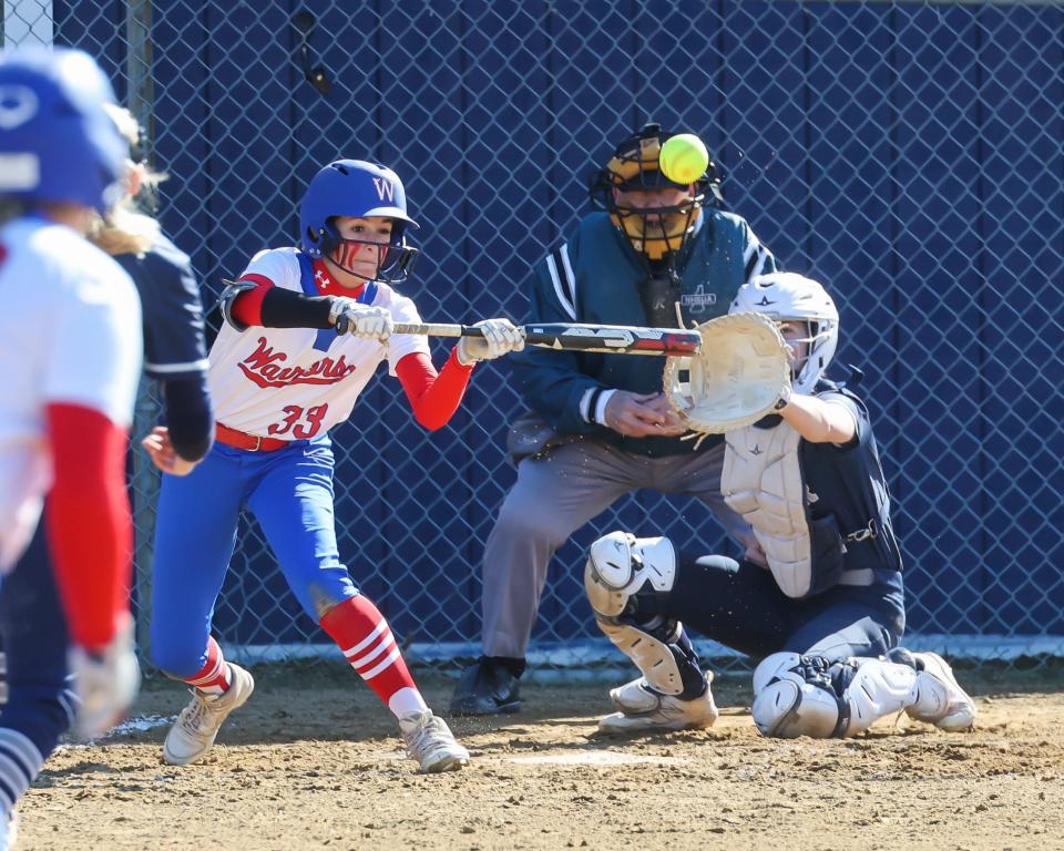 Winnacunnet's Arden Langmaid puts down a bunt during Friday's Division I softball game against Exeter.