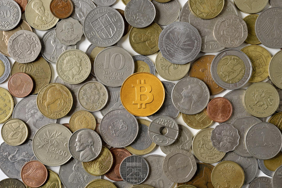 Bitcoin surrounded by various world coins