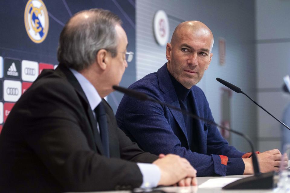 Zinedine Zidane looks at President of Real Madrid, Florentino Perez, left, during a press conference in Madrid, Spain, Thursday, May 31, 2018. Zidane quit as Real Madrid coach on Thursday, less than a week after leading the team to its third straight Champions League title, saying the club needed a change in command. (AP Photo/Borja B. Hojas)