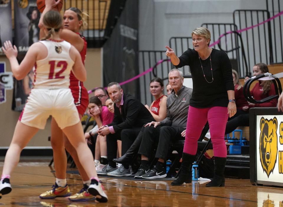 New Palestine head coach Sarah Gizzi directs from the bench during a game against Shelbyville on Tuesday, Dec. 6, 2022, at Shelbyville High School. Sarah's daughter Isabella recently became the New Palestine girls basketball scoring leader, surpassing the record her mother set in the 1990s. 