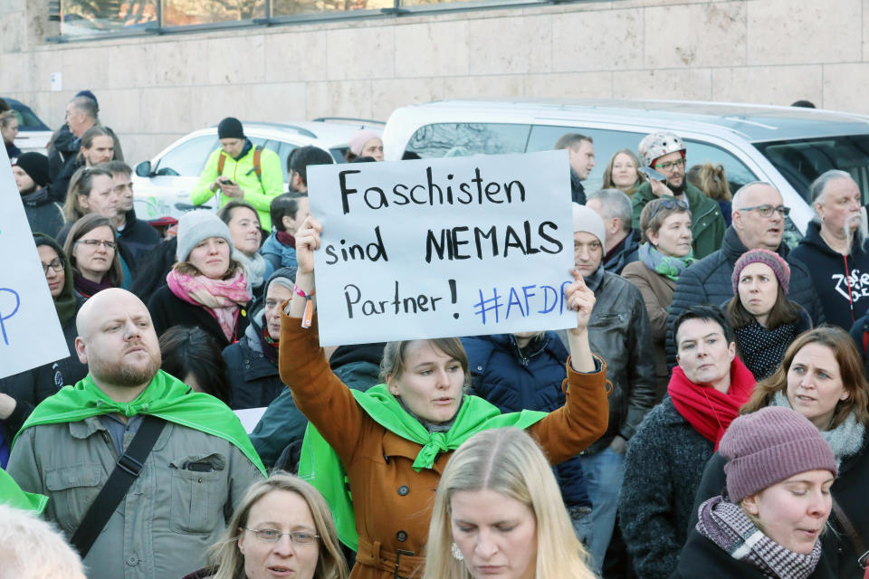 05 February 2020, Thuringia, Erfurt: Under the slogan "against fascism" people demonstrate, among other things with a poster "Fascists are NEVER partners" #AFDP" after an appeal of the party Die Linke in front of the state parliament after the election of Thomas L. Kemmerich (FDP) as Prime Minister of Thuringia. A good three and a half months after the state elections, the FDP politician Thomas Kemmerich has been elected Minister President of Thuringia by a surprise vote of the AfD. Photo: Bodo Schackow/dpa-Zentralbild/dpa (Photo by Bodo Schackow/picture alliance via Getty Images)