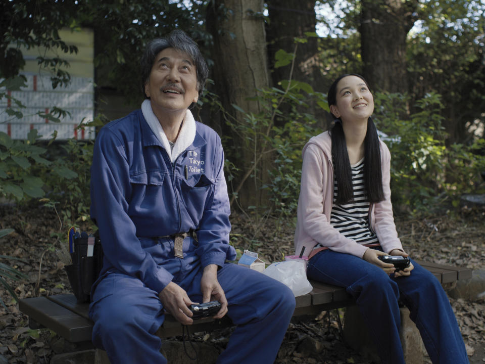 This image released by Neon shows Kôji Yakusho, left, and Arisa Nakano in a scene from "Perfect Days." (Neon via AP)