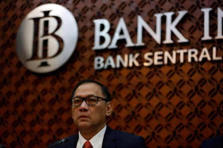 FILE PHOTO: Governor of Bank Indonesia Agus Martowardojo speaks during a news briefing at the bank's headquarters in Jakarta, Indonesia, November 16, 2017. REUTERS/Darren Whiteside/File Photo