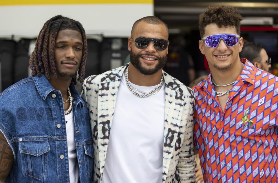 Left to right: Dallas Cowboys wide receiver Cedarian "CeeDee" Lamb, Dallas Cowboys quarterback Dak Prescott and Kansas City Chiefs quarterback Patrick Mahomes arrive before the start of the Formula One Miami Grand Prix at the Miami Miami International Autodrome in Miami Gardens, Fla., Sunday, May 7, 2023. (Matias J. Ocner/Miami Herald via AP)