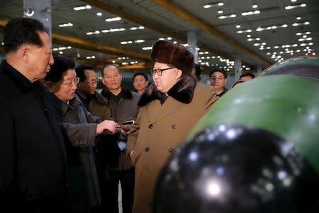 North Korean leader Kim Jong Un meets scientists and technicians in the field of researches into nuclear weapons in this undated photo released by North Korea's Korean Central News Agency (KCNA) in Pyongyang March 9, 2016. REUTERS/KCNA/Files