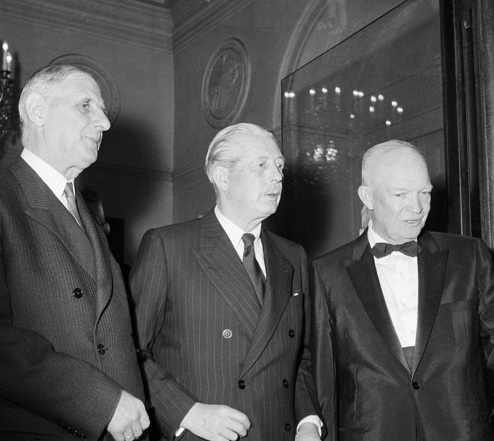 FILE - In this Tuesday, May 17, 1960 file photo, President Charles de Gaulle of France, left, Premier Harold MacMillan of Britain, center, and U.S. President Dwight D. Eisenhower leave a summit at the Elysee Palace in Paris. De Gaulle would veto Britain's application to join the then European Economic Community on two occasions that decade. Britain eventually joined in 1973 after De Gaulle's successor, Georges Pompidou, lifted France's veto. On Jan. 31, 2020, Britain is scheduled to leave what became known as the European Union. (AP Photo, File)