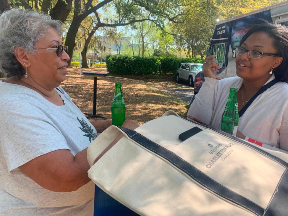 Luz Espada, left, discusses pros and cons with her granddaughter, Briana Hurdle, after the pair attended a job fair for hospitality industry on Wednesday, April 7, 2021 . “Some of these places are offering bonuses,” Espada said of Charleston hotels. “There’s a lot to consider.” Caitlin Byrd/The State