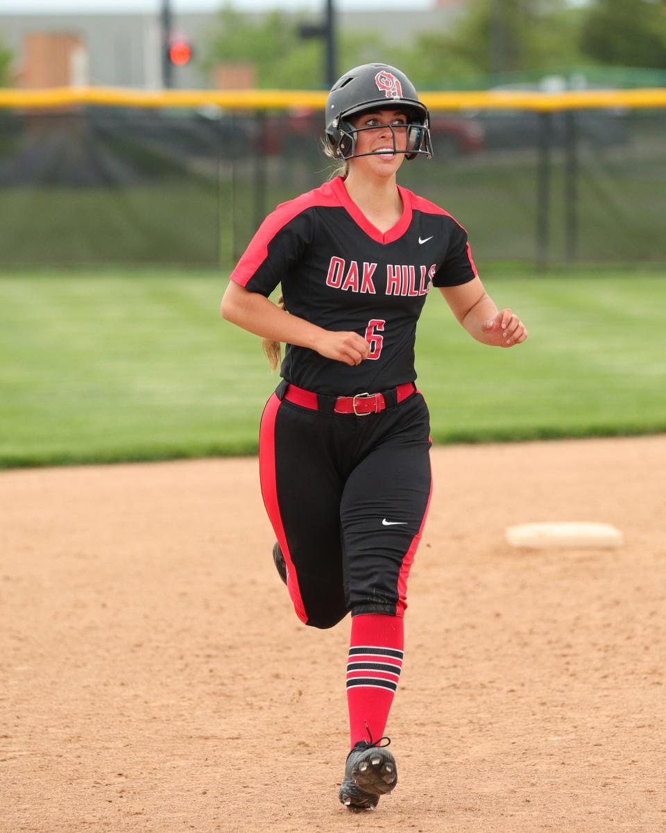 Oak Hills' Kailee Hebert celebrates her game-winning home run in the bottom of the seventh inning in the OHSAA softball tournament game between Oak Hills and Lebanon high schools May 19, 2022, at Mason High School.