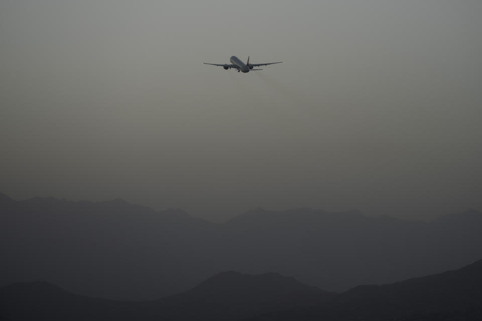 FILE - A Qatar Airways aircraft takes off with foreigners from the airport in Kabul, Afghanistan, Thursday, Sept. 9, 2021, as some 200 foreigners, including Americans, flew out of the country, the first such large-scale departure since U.S and foreign forces concluded their frantic withdrawal at the end of the previous month. (AP Photo/Bernat Armangue, File)