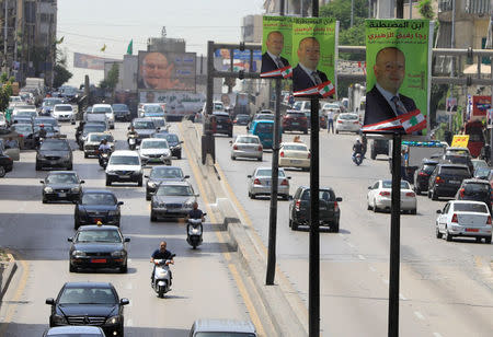 Campaign posters of Lebanese parliament candidates are seen in Beirut, Lebanon May 4, 2018. REUTERS/Jamal Saidi