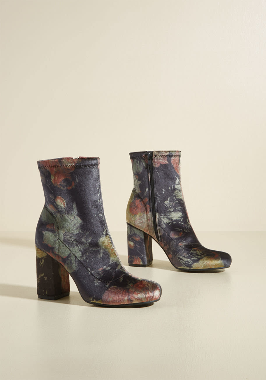 Shop them <a href="https://www.modcloth.com/shop/newarrivals/transformative-trot-velvet-block-heel-bootie/153748.html?dwvar_153748_color=BLKMU&amp;cgid=" target="_blank"><strong>here</strong></a>.