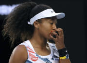 Japan's Naomi Osaka reacts during her third round singles match against Coco Gauff of the U.S. at the Australian Open tennis championship in Melbourne, Australia, Friday, Jan. 24, 2020. (AP Photo/Lee Jin-man)