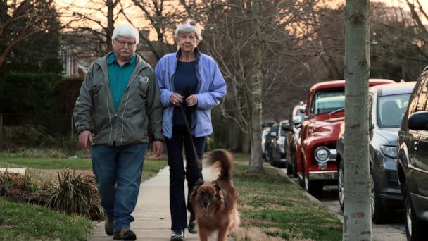 PHOTO: Chris Johnson and his wife Ginnie Grevett take a walk. (ABC News)