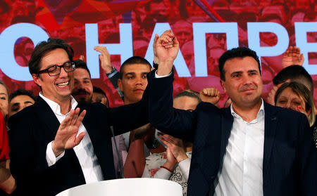 Presidential candidate of the ruling SDSM Stevo Pendarovski and North Macedonia's Prime Minister Zoran Zaev celebrate after preliminary results during the presidential election in Skopje, North Macedonia May 5, 2019. REUTERS/Ognen Teofilovski