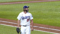 Los Angeles Dodgers starting pitcher Clayton Kershaw heads to the dugout after completing the top of the sixth inning against the San Diego Padres in Game 2 of a baseball National League Division Series Wednesday, Oct. 7, 2020, in Arlington, Texas. (AP Photo/Sue Ogrocki)