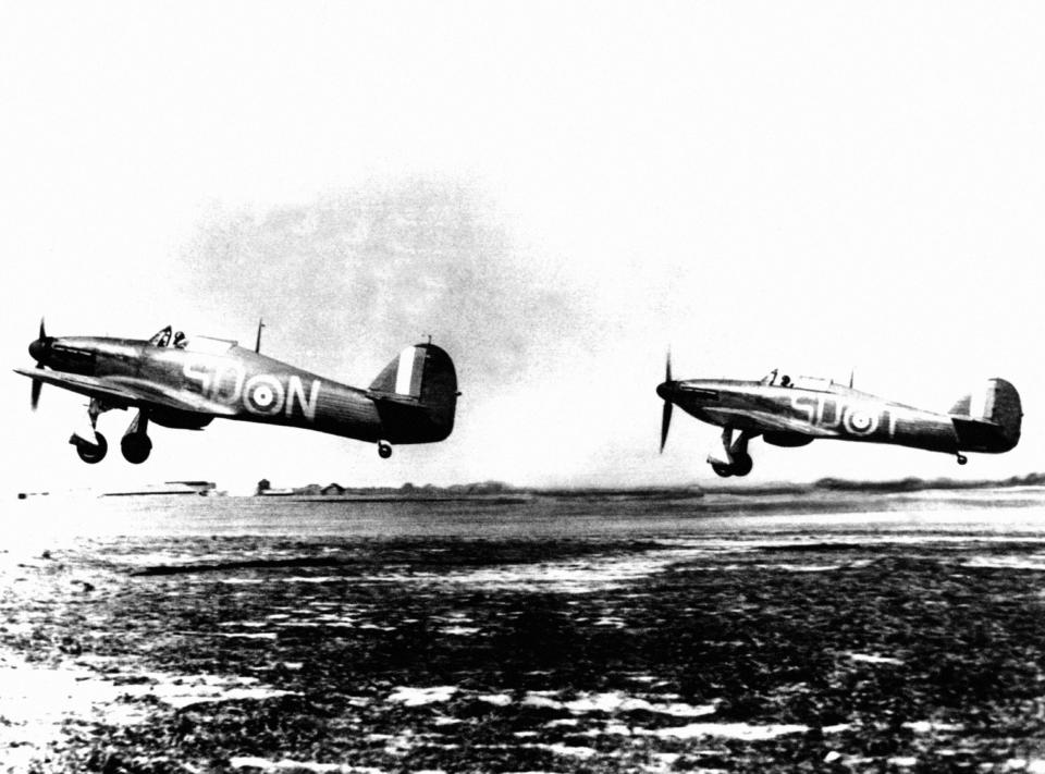 Two RAF Hawker Hurricane MK1 fighters from RAF 79 Squadron taking off from RAF Hawkinge, Kent during the Battle of Britain