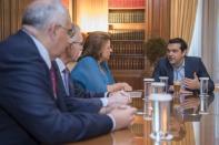 Greek Prime Minister Alexis Tsipras meets with head of the Greek bank association Louka Katseli(C) and members of the association's board at his office at the Maximos Mansion in this handout photo released by the Greek Prime Minister's office in Athens, Greece July 22, 2015. REUTERS/Andrea Bonetti/Greek Prime Minister's Office/Handout via Reuters