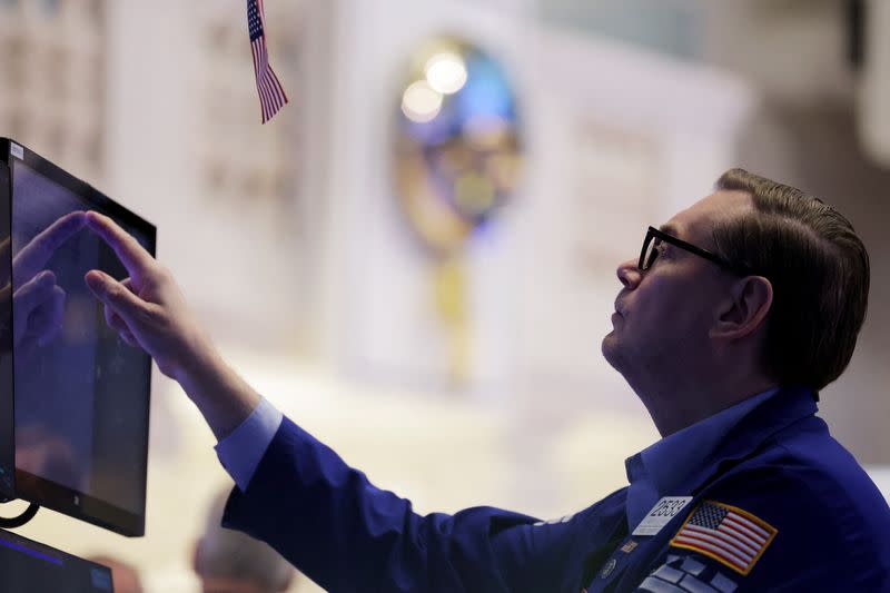 A trader works on the trading floor at the New York Stock Exchange (NYSE) in New York City