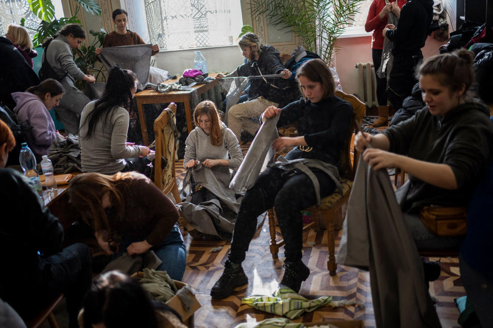 Volunteers tear cloth into strips to make camouflage nets in Lviv on Feb. 28.<span class="copyright">Bernat Armangue—AP</span>