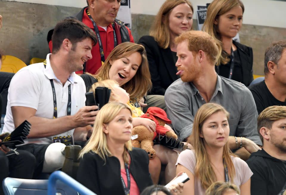 Harry even stuck his tongue out at the little girl. Photo: Getty Images