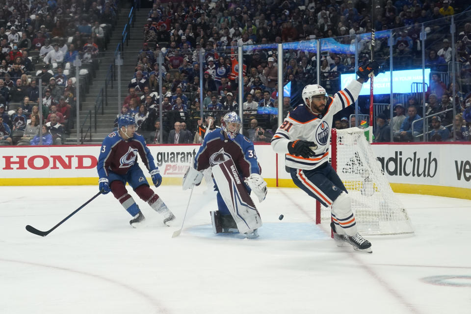 Edmonton Oilers left wing Evander Kane (91) celebrates a goal against Colorado Avalanche goaltender Darcy Kuemper (35) during the first period in Game 1 of the NHL hockey Stanley Cup playoffs Western Conference finals Tuesday, May 31, 2022, in Denver. (AP Photo/Jack Dempsey)