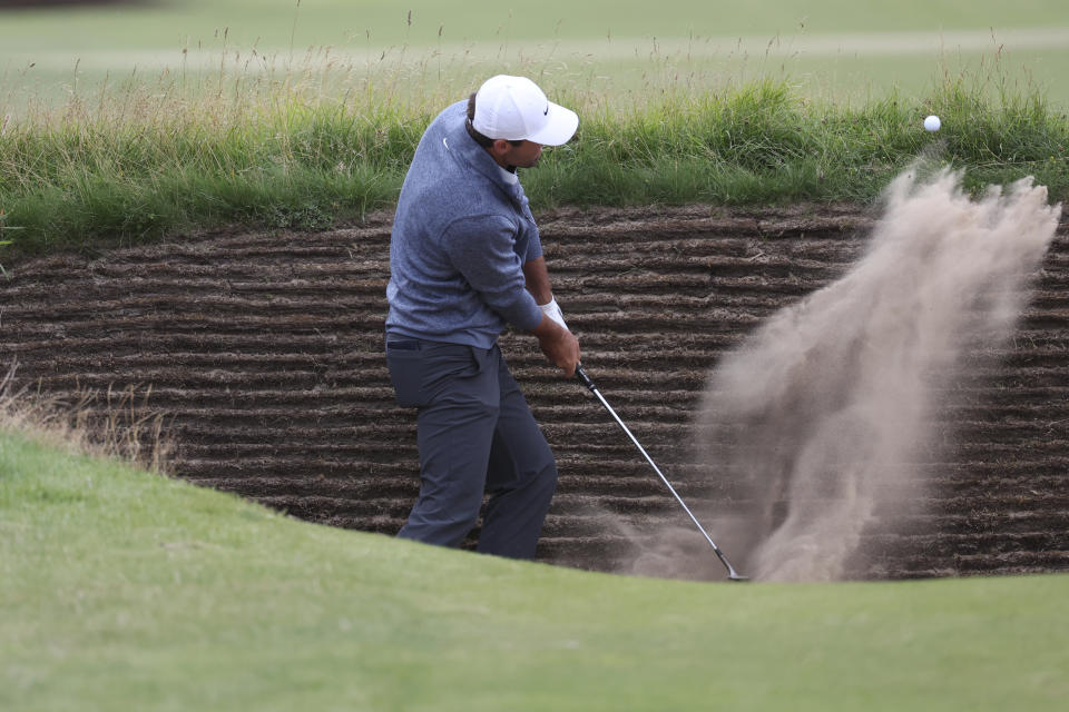 United States' Scottie Scheffler hits out of a bunker on the 16th hole during the second day of the British Open Golf Championships at the Royal Liverpool Golf Club in Hoylake, England, Friday, July 21, 2023. (AP Photo/Peter Morrison)